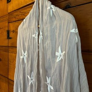 Long mushroom/beige loose weave thin fashion scarf embroidered with starfish.